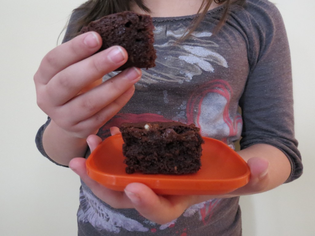 We couldn't wait until they were cooled down to slice into them.  Warm brownies equals happy child.  In all of us.