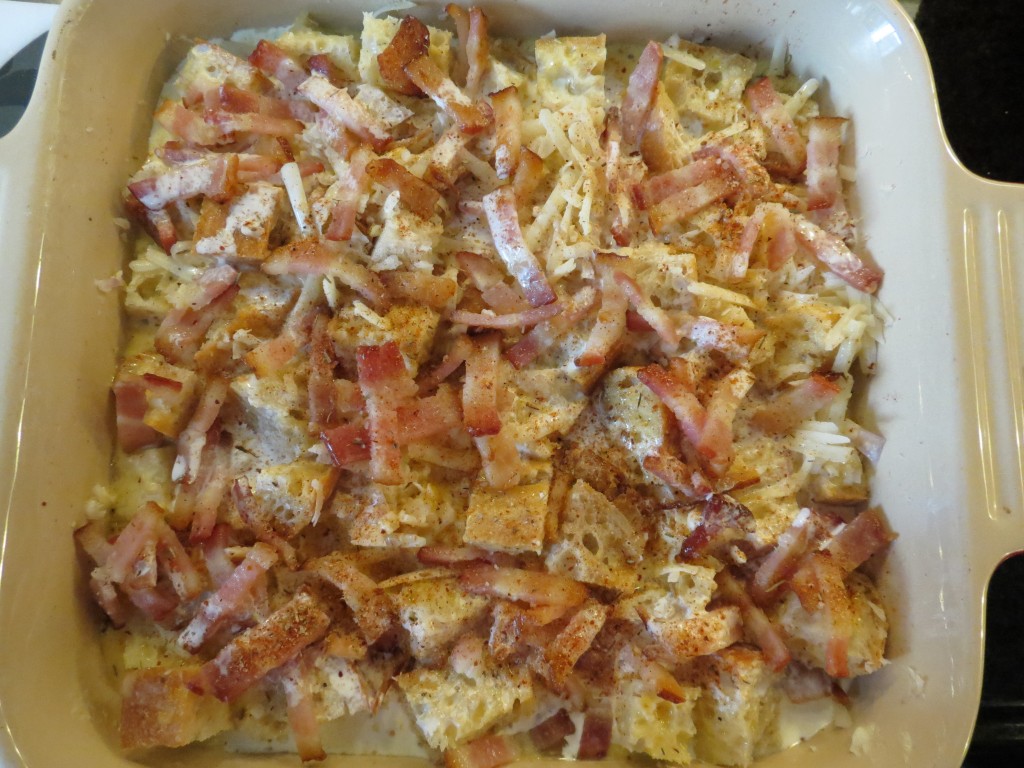 Then add the eggy mixture on top of the bread, then layer with the bacon.  Mmm, bacon.