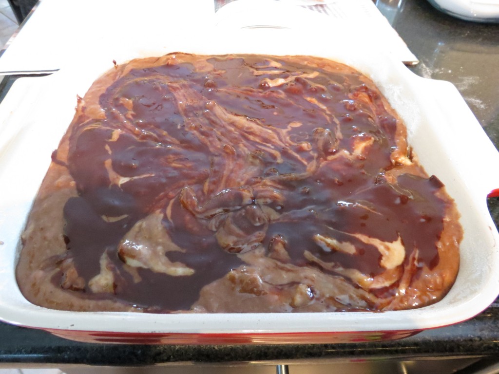 The final drizzle of melted chocolate on top of the batter.  If you're a raw cookie dough lover, beware making these beauties.  I dare you not to dip your finger in there...