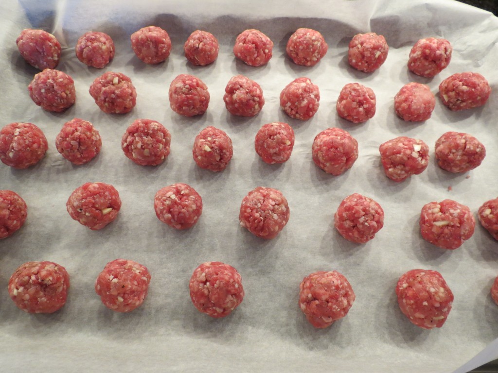 Pretty little meatballs all in a row, ready for a quick bake in the oven.
