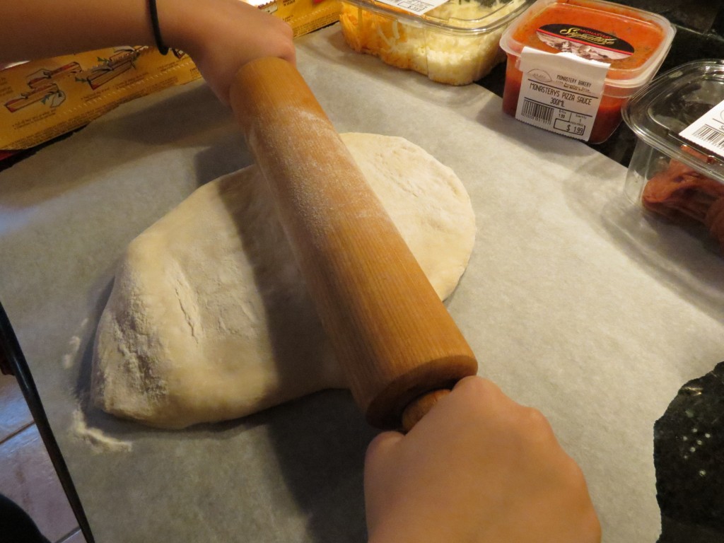 My mom's rolling pin, still in action after all these decades.  And doing a great job with little hands at the helm!