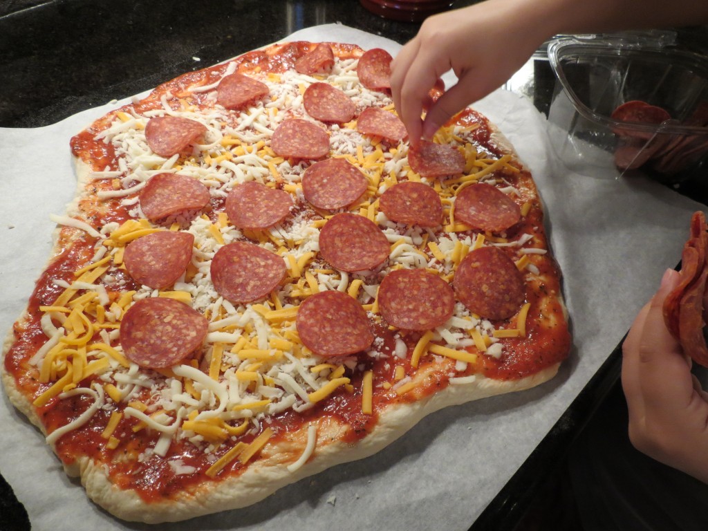Pizza toppings is where all of the creativity comes out.  It's like watching a little Picasso at work.