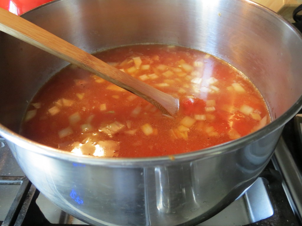 Something good's cooking.  Here are the tomatoes, onions and garlic simmering gently until it's time to add the pasta.
