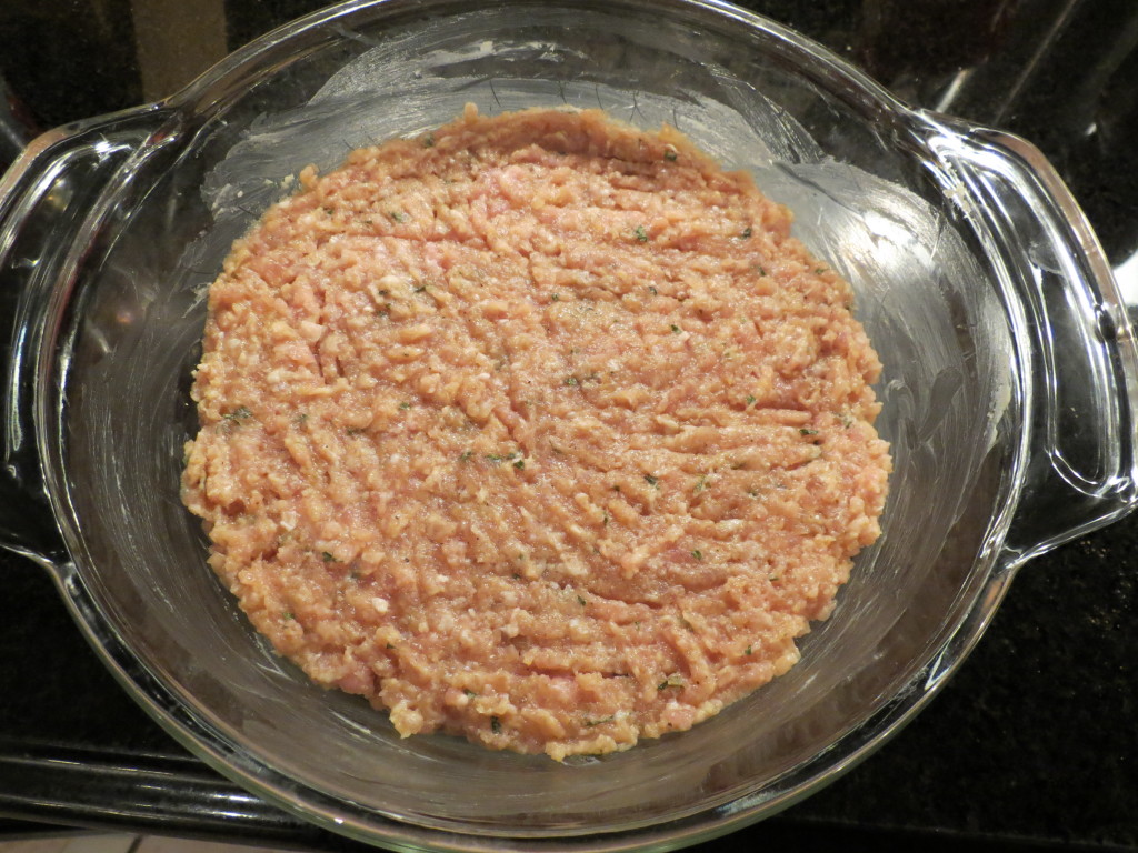 Getting the Meatzza ready for supper.  Meatloaf meets pizza for a fabulous tasting crowd pleasing entree.