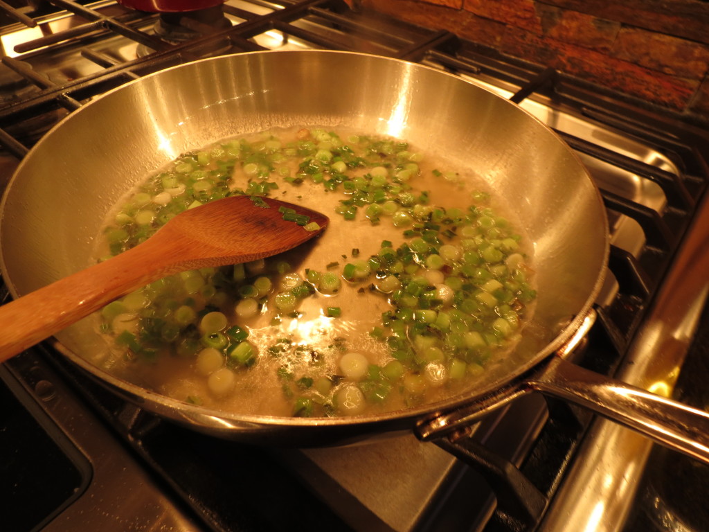 Sizzling spring onions in the pan promise good things to come!